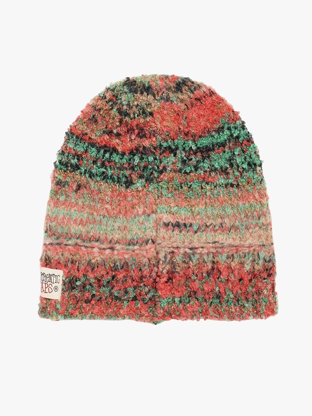 Image may contain: Cap, Clothing, Hat, Beanie, Knitwear, and Sweater