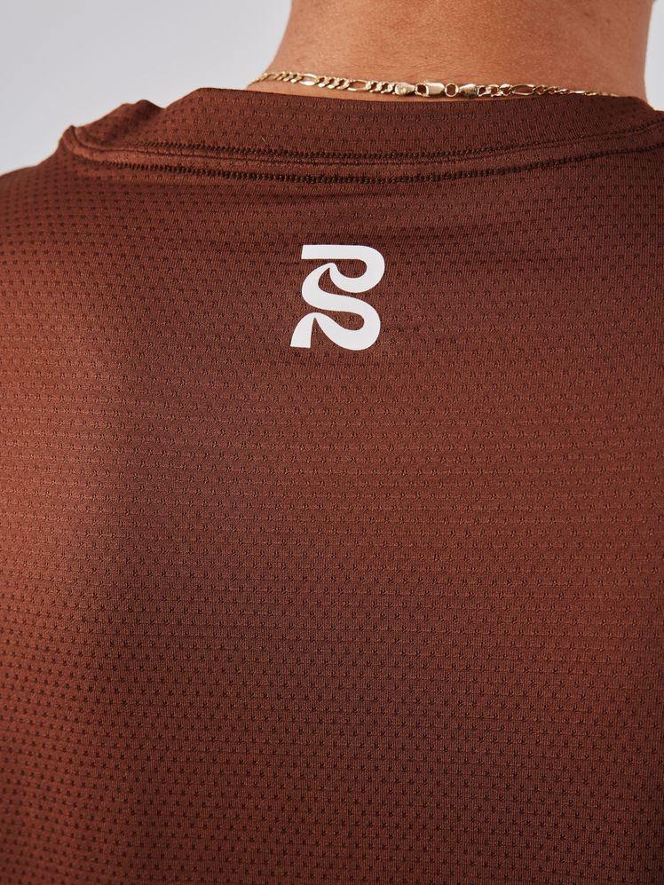 Image may contain: Number, Symbol, Text, Adult, Person, Clothing, and Shirt