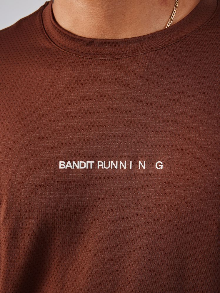 Image may contain: Clothing, T-Shirt, Adult, Person, Accessories, Bracelet, Jewelry, and Shirt