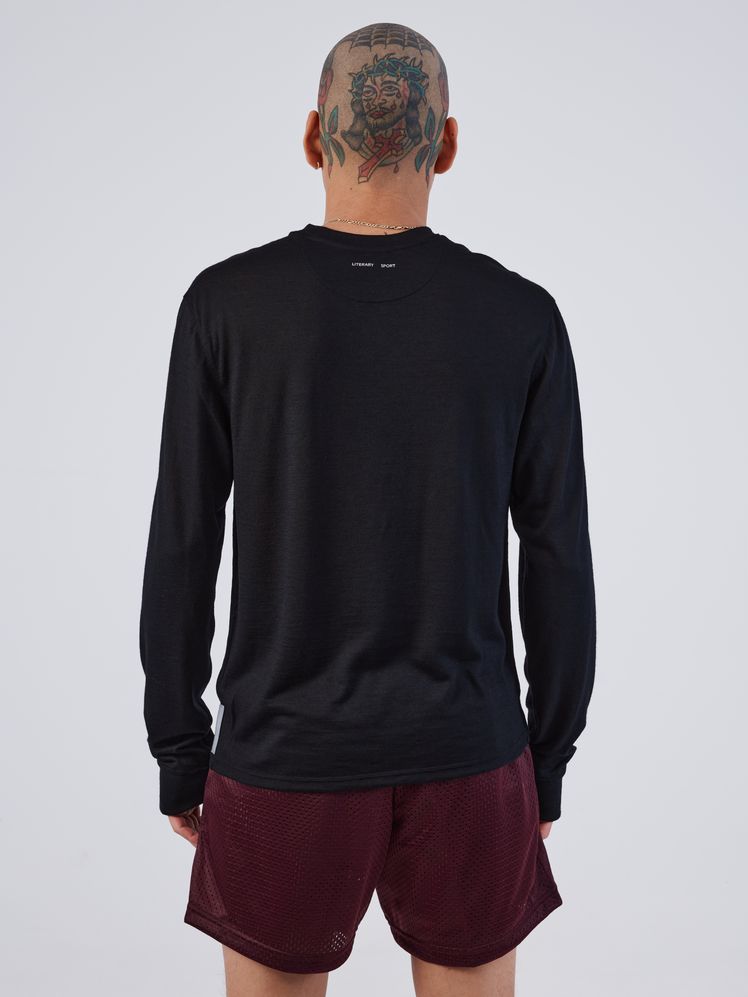 Image may contain: Clothing, Long Sleeve, Sleeve, Adult, Person, Shorts, Knitwear, Sweater, Sweatshirt, and Accessories