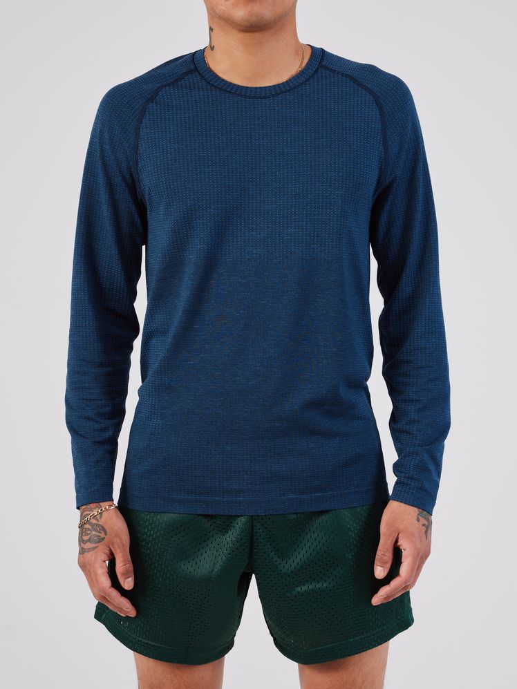 Image may contain: Clothing, Long Sleeve, Sleeve, Knitwear, Sweater, Shorts, Adult, and Person