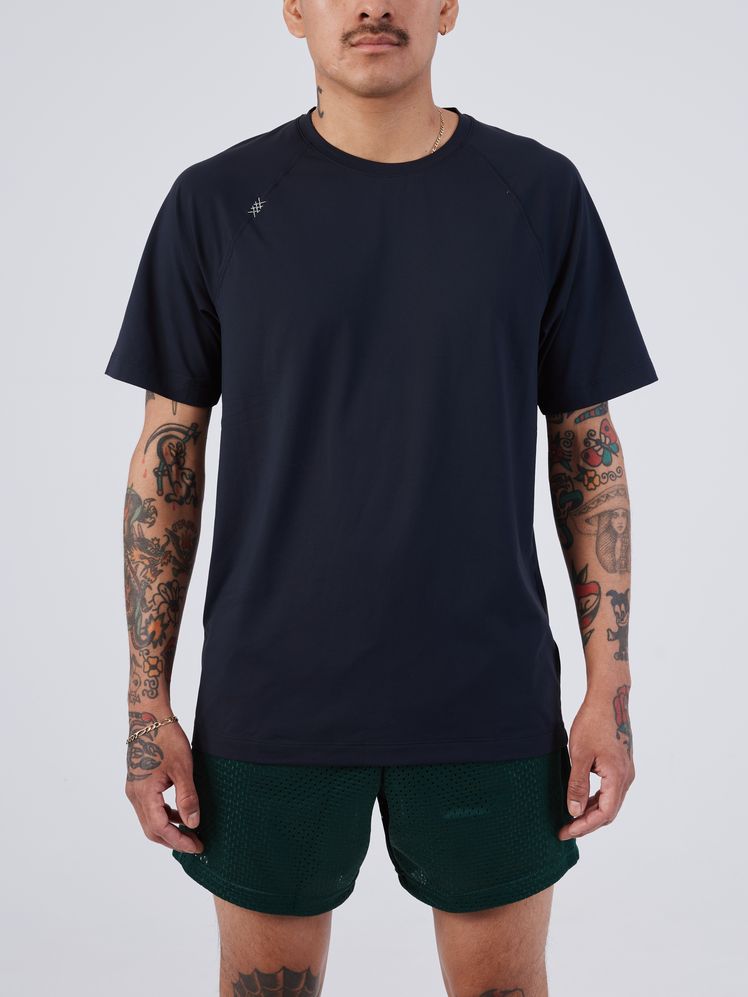 Image may contain: Clothing, T-Shirt, Sleeve, Adult, Person, Shorts, Skin, and Tattoo