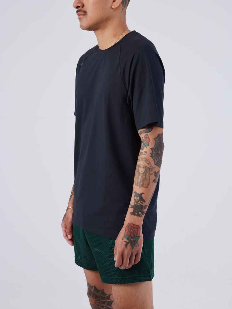 Image may contain: Clothing, T-Shirt, Sleeve, Long Sleeve, Shorts, Adult, Person, Beachwear, Accessories, and Jewelry