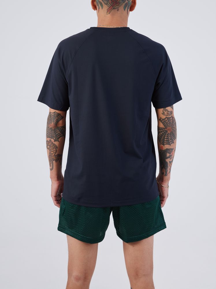 Image may contain: Clothing, Shorts, T-Shirt, Sleeve, Adult, Person, Skin, and Tattoo