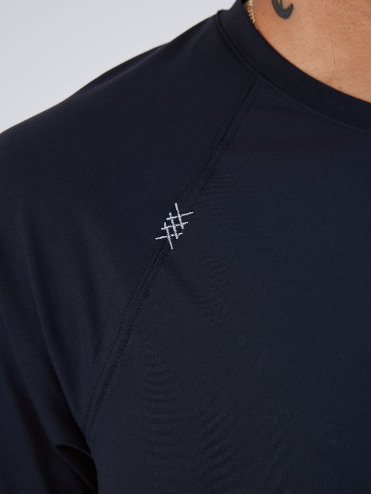 Image may contain: Clothing, T-Shirt, Long Sleeve, Sleeve, Shirt, Adult, and Person