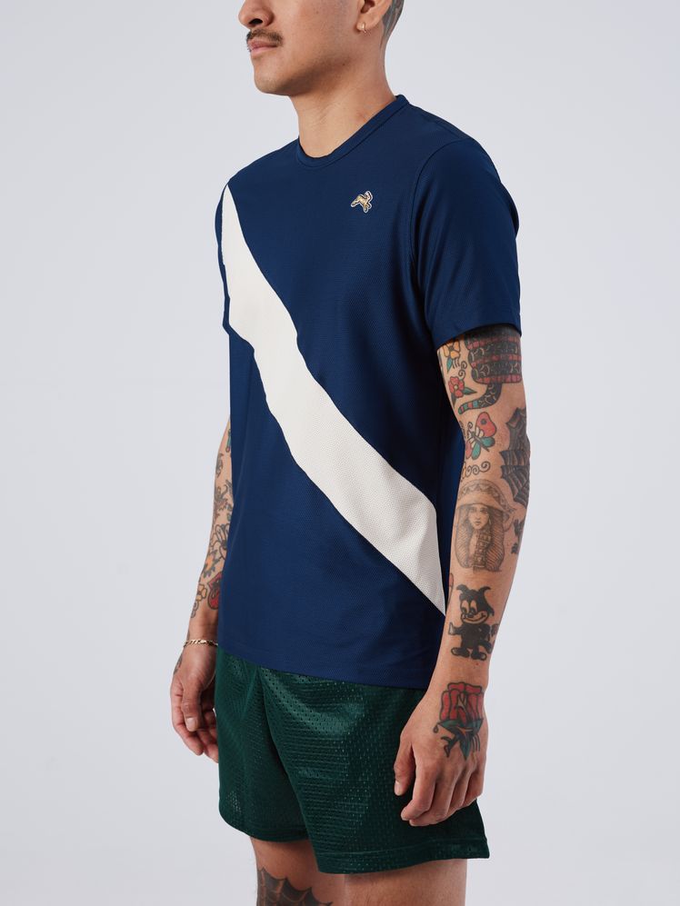 Image may contain: Clothing, T-Shirt, Sleeve, Long Sleeve, Adult, Person, Shorts, Skin, and Tattoo