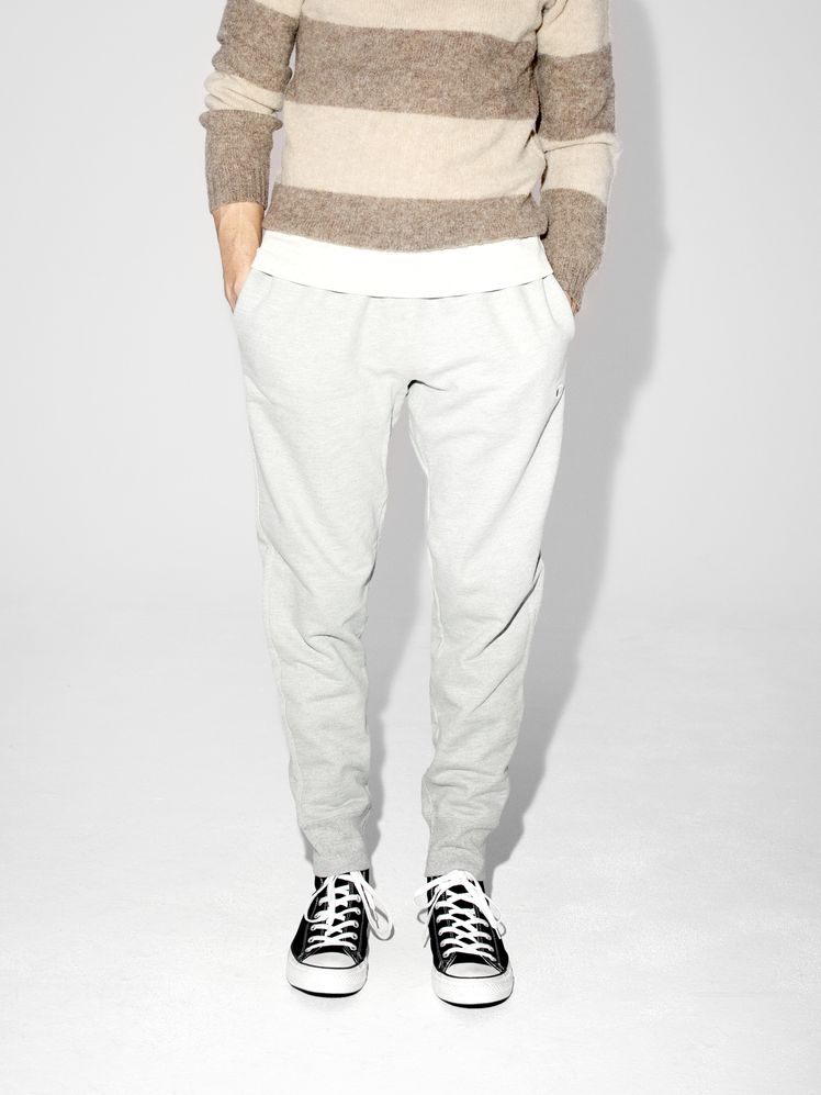 Image may contain: Clothing, Footwear, Shoe, Pants, Sneaker, Adult, Person, Home Decor, Linen, Knitwear, and Sweater