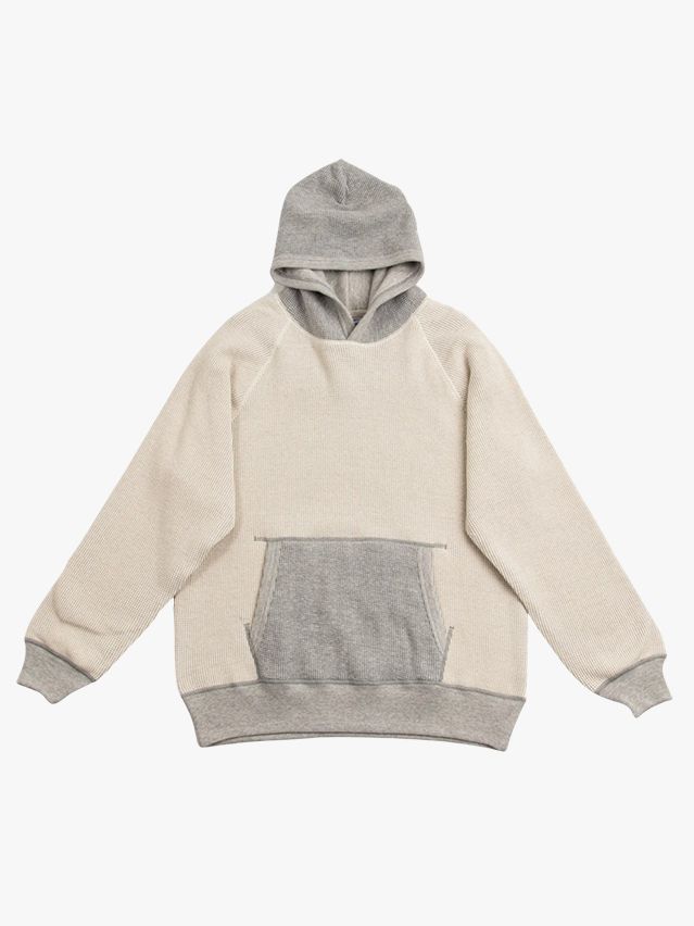 Image may contain: Clothing, Knitwear, Sweater, Sweatshirt, Hoodie, and Hood