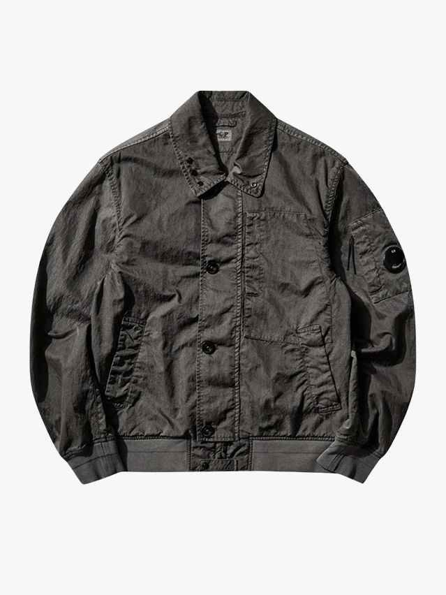 Image may contain: Clothing, Coat, Jacket, Cap, and Hat