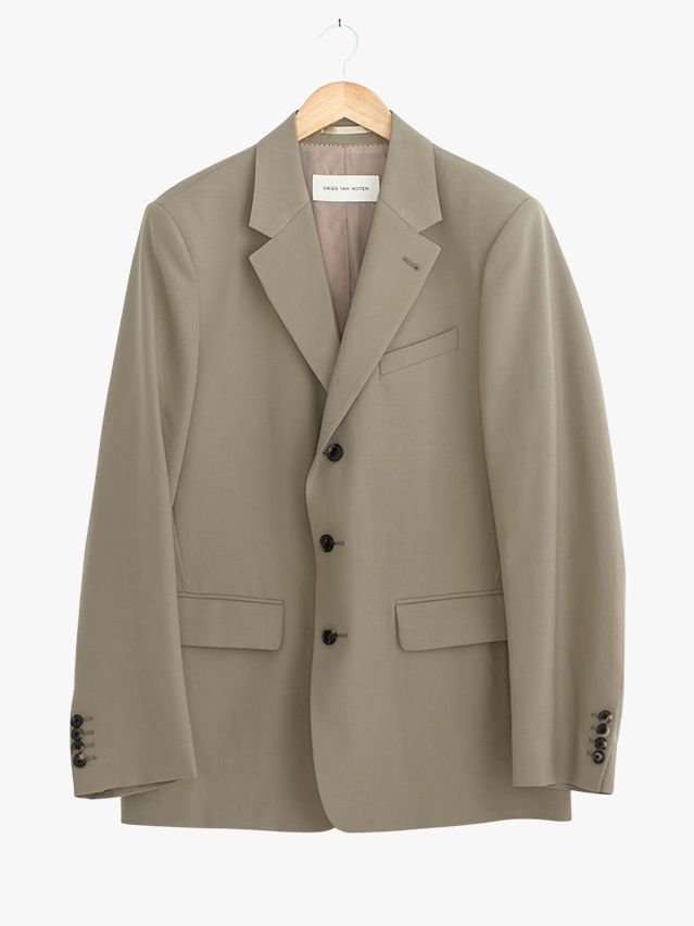 Image may contain: Blazer, Clothing, Coat, Jacket, Formal Wear, Suit, and Khaki