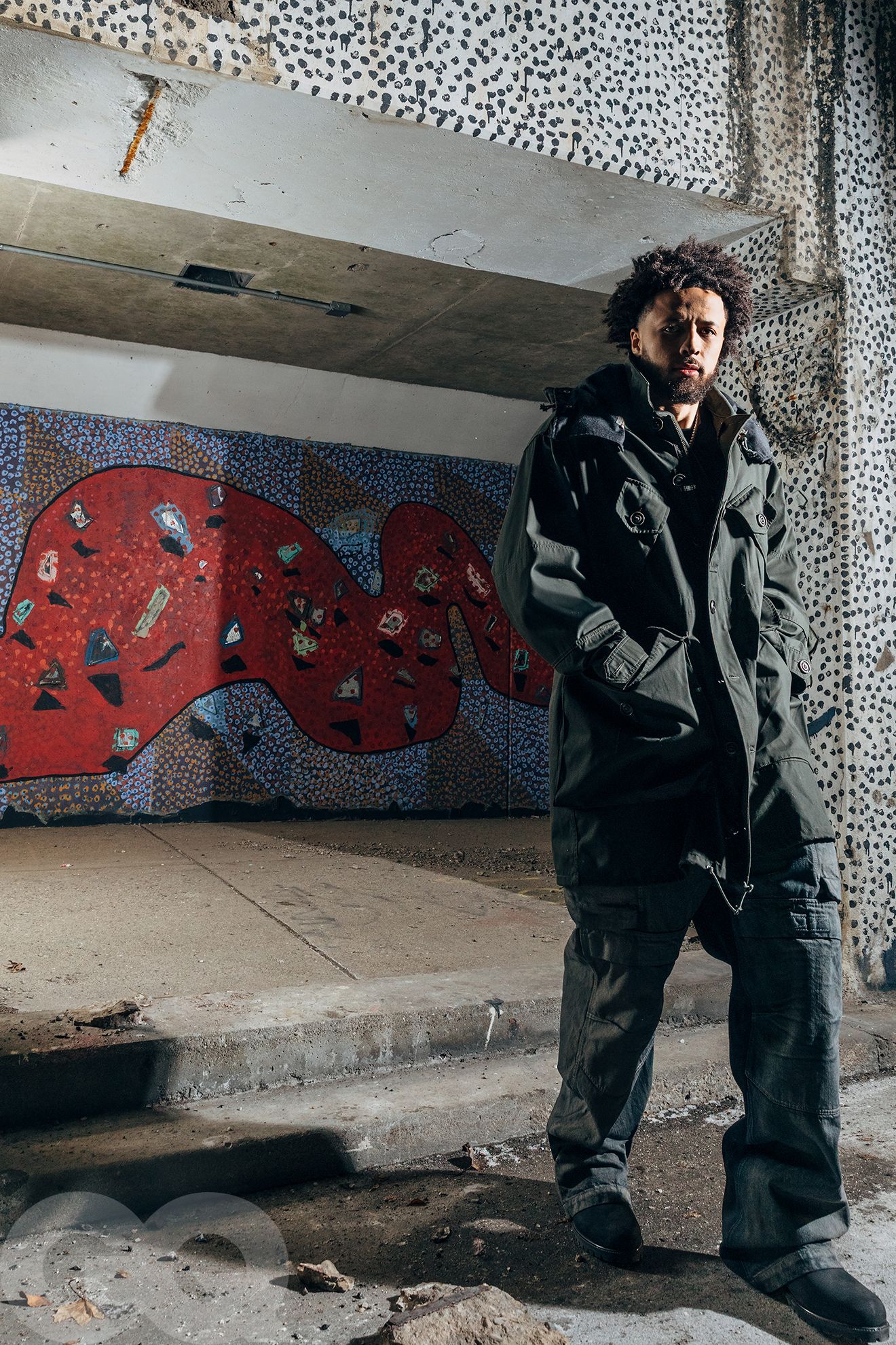 Image may contain Curly Hair Hair Person Clothing Coat and Adult