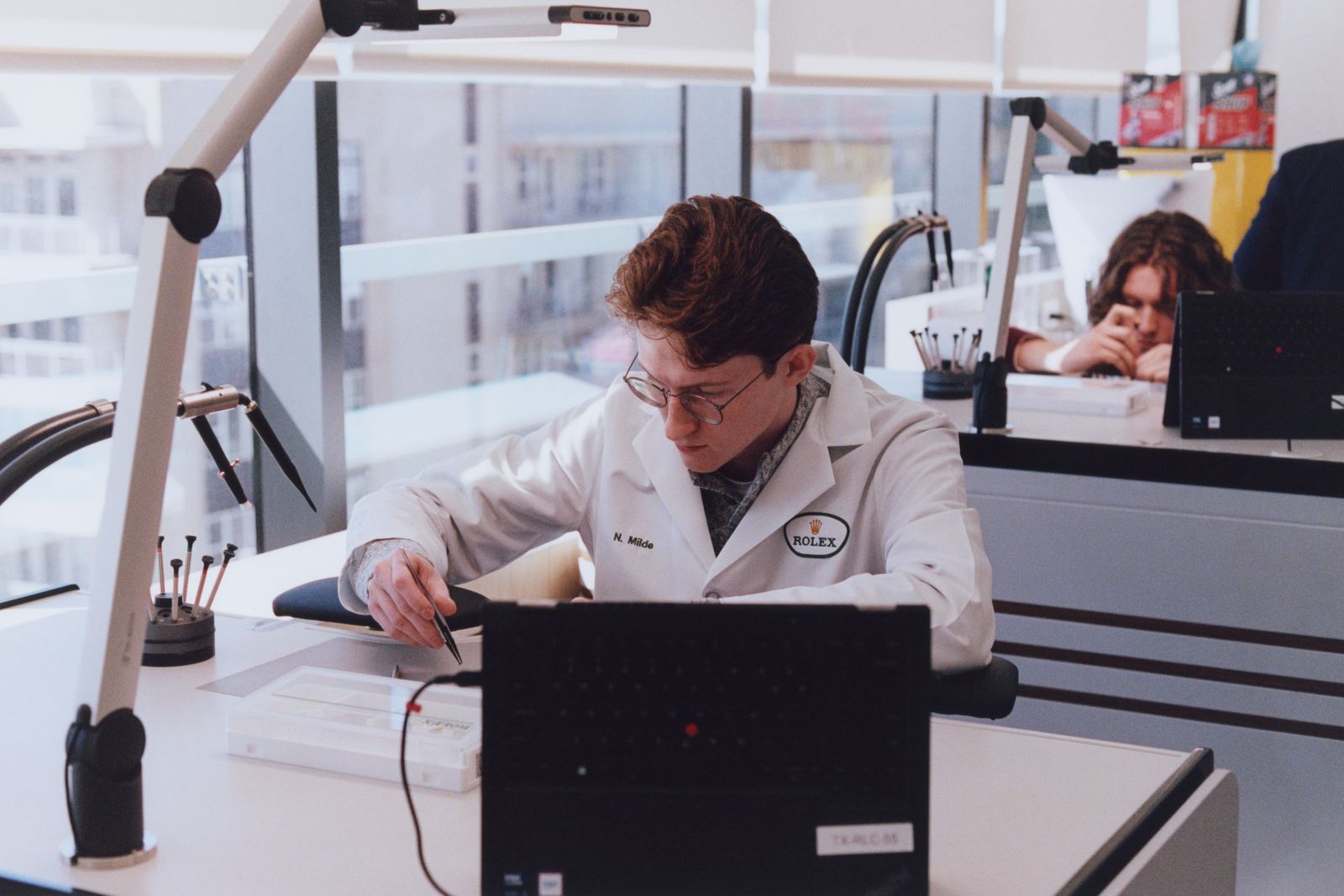 Image may contain Adult Person Clothing Coat Computer Electronics Laptop Pc Face and Head