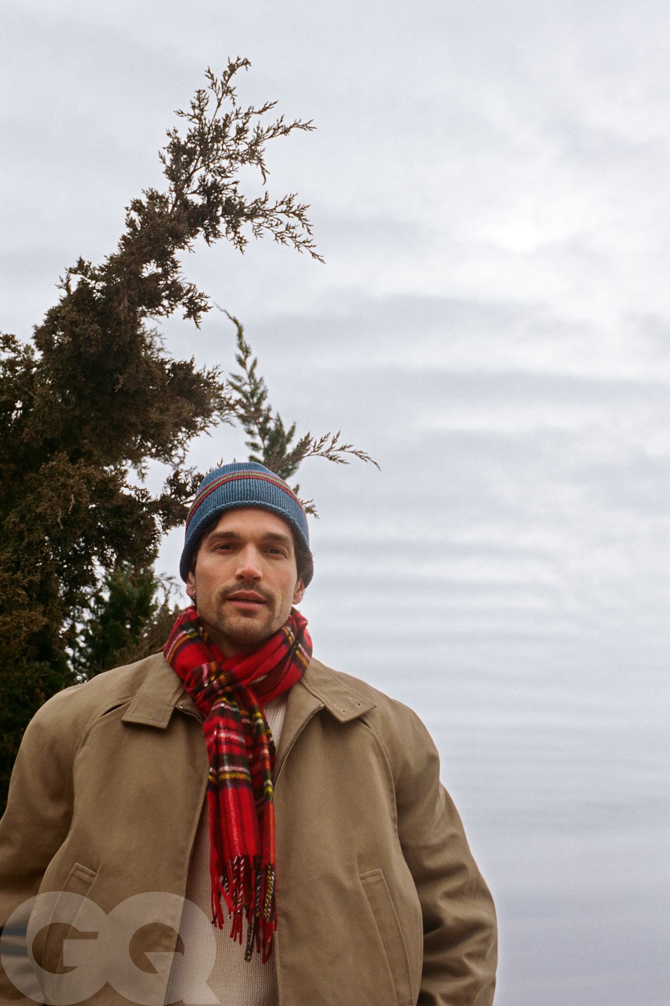 Image may contain Robert Avellanet Clothing Coat Face Head Person Photography Portrait Scarf Cap Hat and Adult