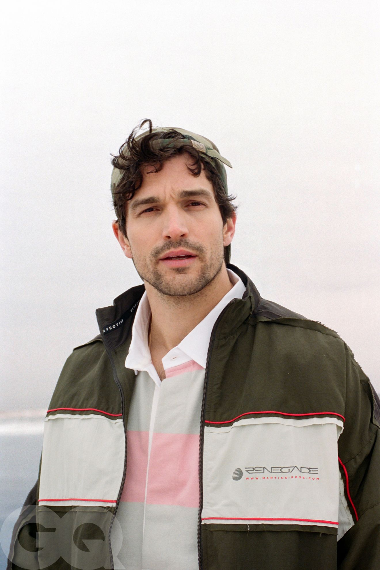 Image may contain Aaron O'Connell Clothing Coat Jacket Face Head Person Photography Portrait Adult and Vest