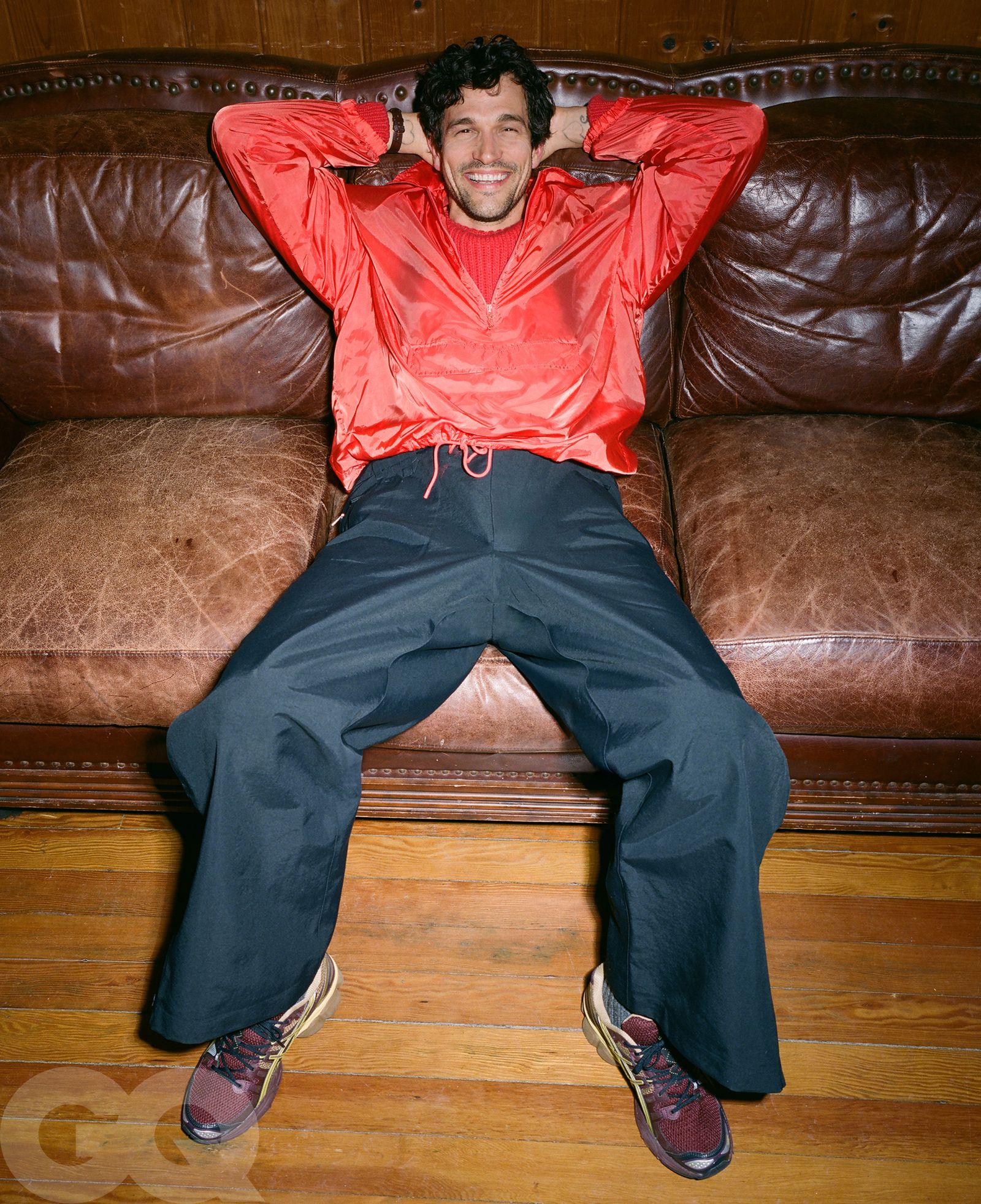 Image may contain Clothing Coat Pants Jacket Adult Person Footwear Shoe Couch Furniture Sitting and Jeans