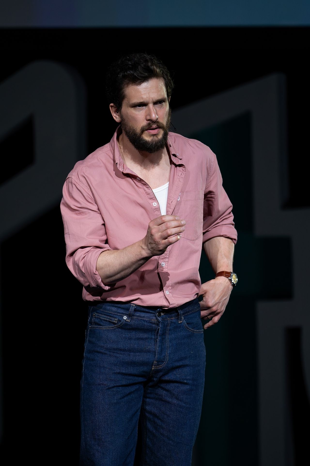 Image may contain Kit Harington People Person Performer Solo Performance Adult Wristwatch Crowd Clothing and Jeans