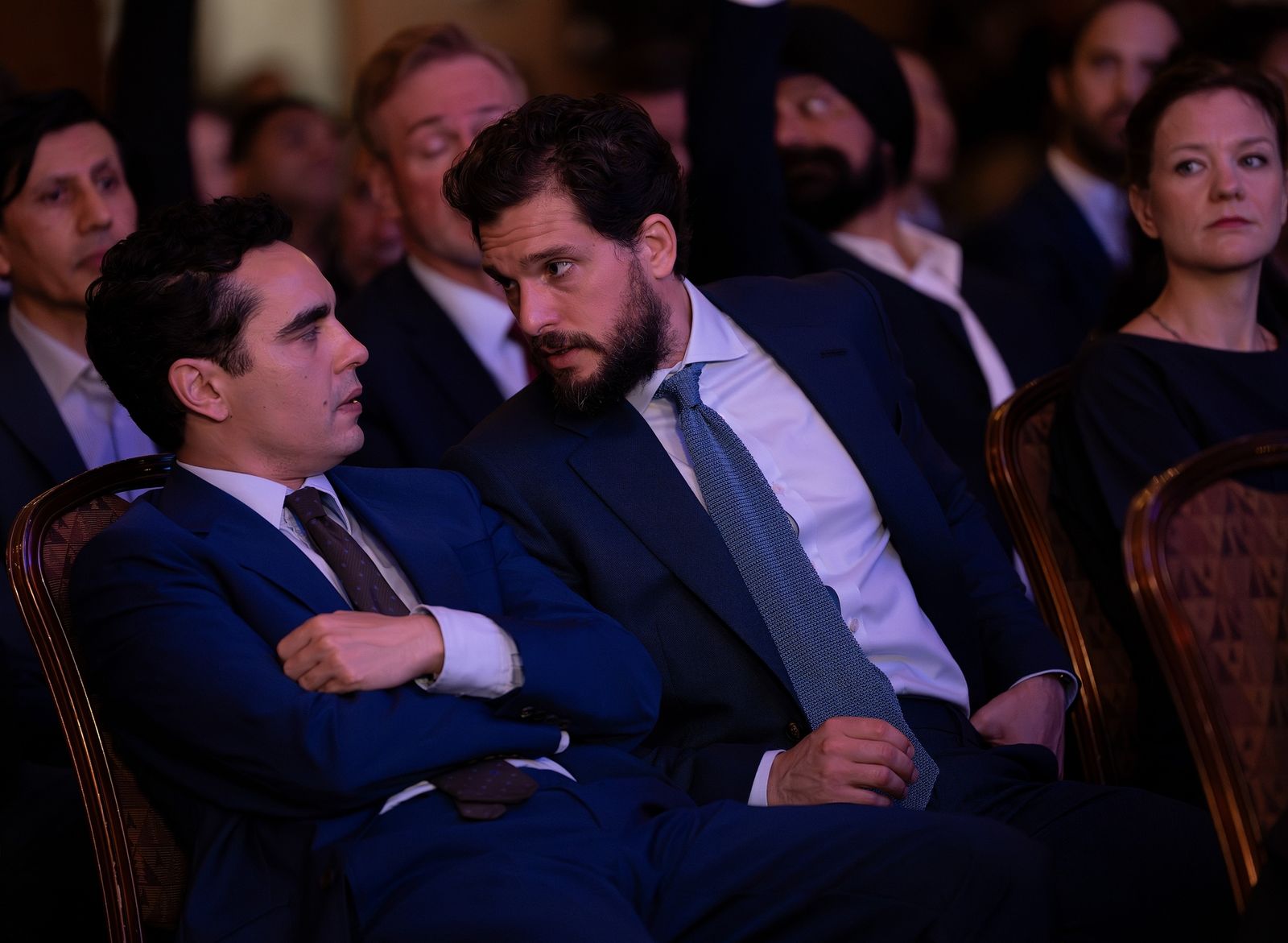 Image may contain Kit Harington Max Minghella Clothing Formal Wear Suit Accessories Tie Blazer Coat and Jacket