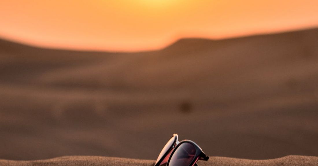 Summer Heat - Wayfarer Sunglasses on Sand Tilt Shift Lens Photography