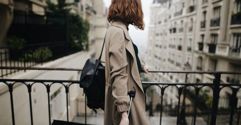 Trench Coat - Shallow Focus Photography Of Woman Beside Fence